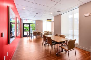 A conference room with a long table and chairs